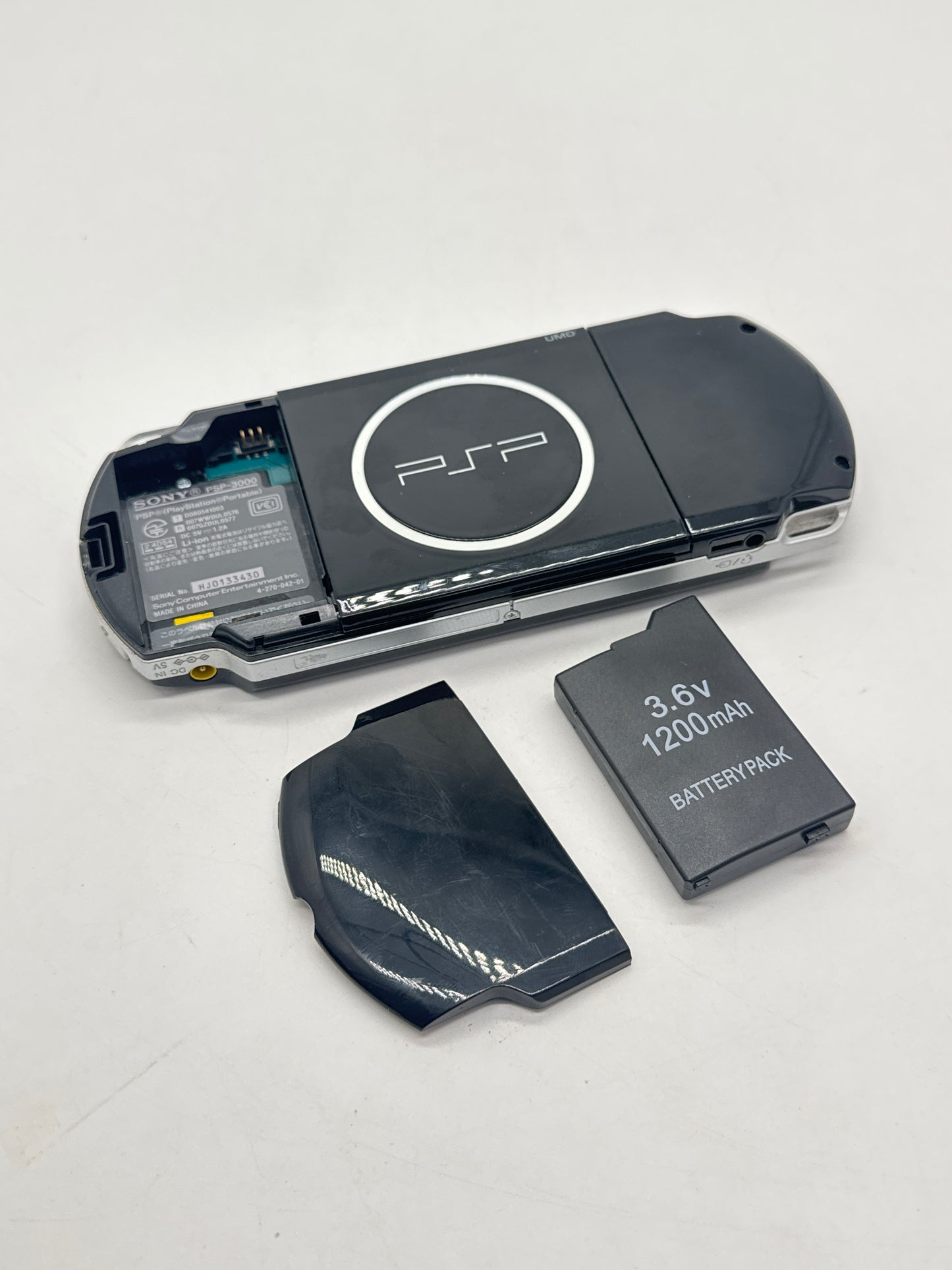 PlayStation Portable PSP-3000 Piano Black Console #667 - Loose Back Lid - Yellow Tint