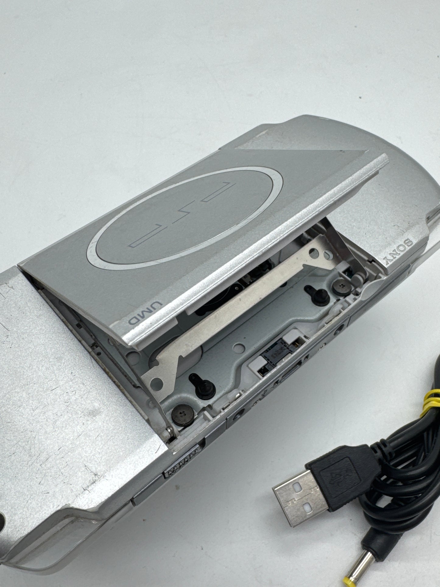 Sony PSP-3000 Silver Console #34 w/ 1200mAh Battery & Charger BAD UMD READ AS IS
