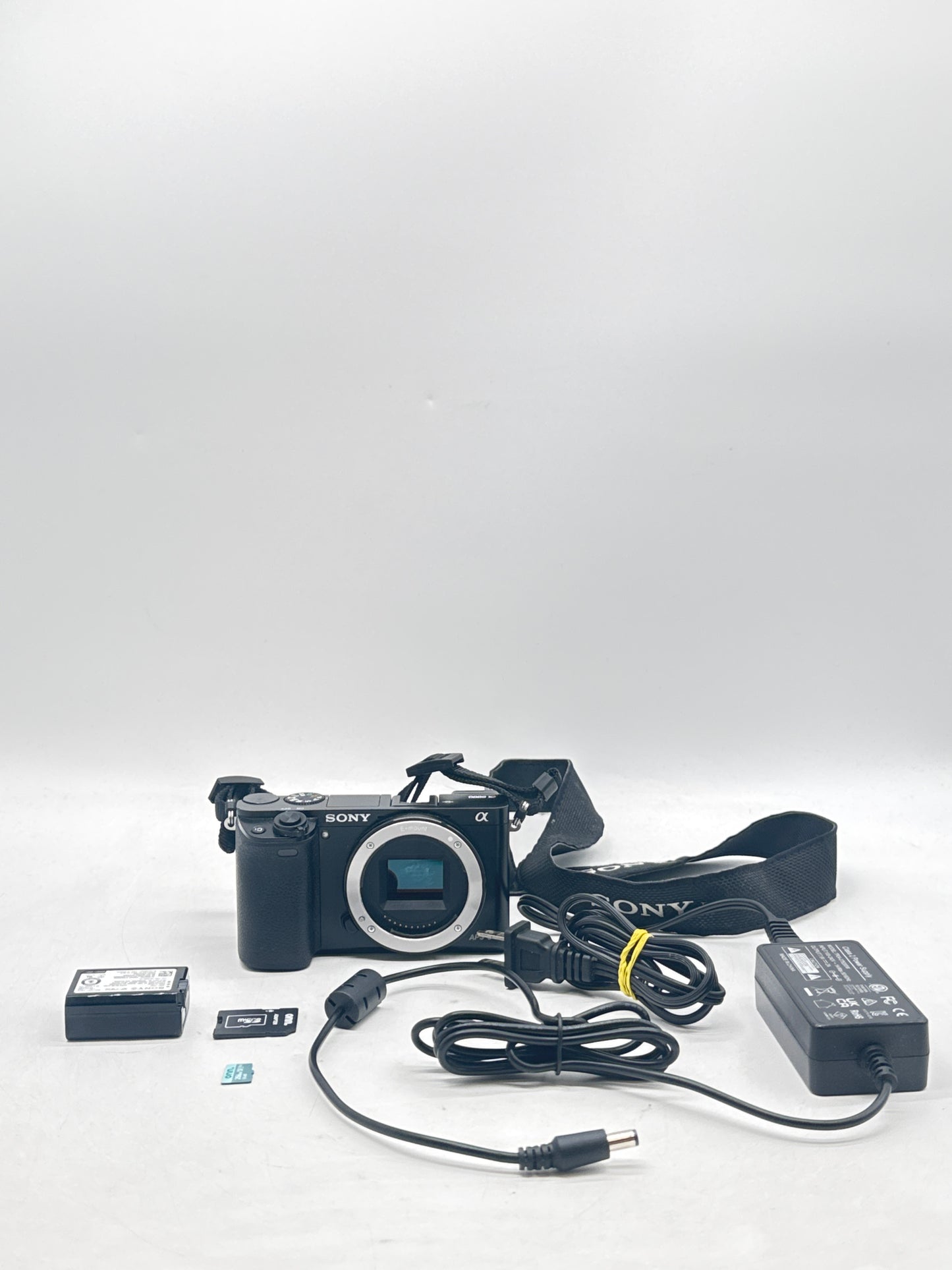 Sony A6000 24.3 MP Mirrorless Digital SLR Camera W/SD Card & Adapter - Black