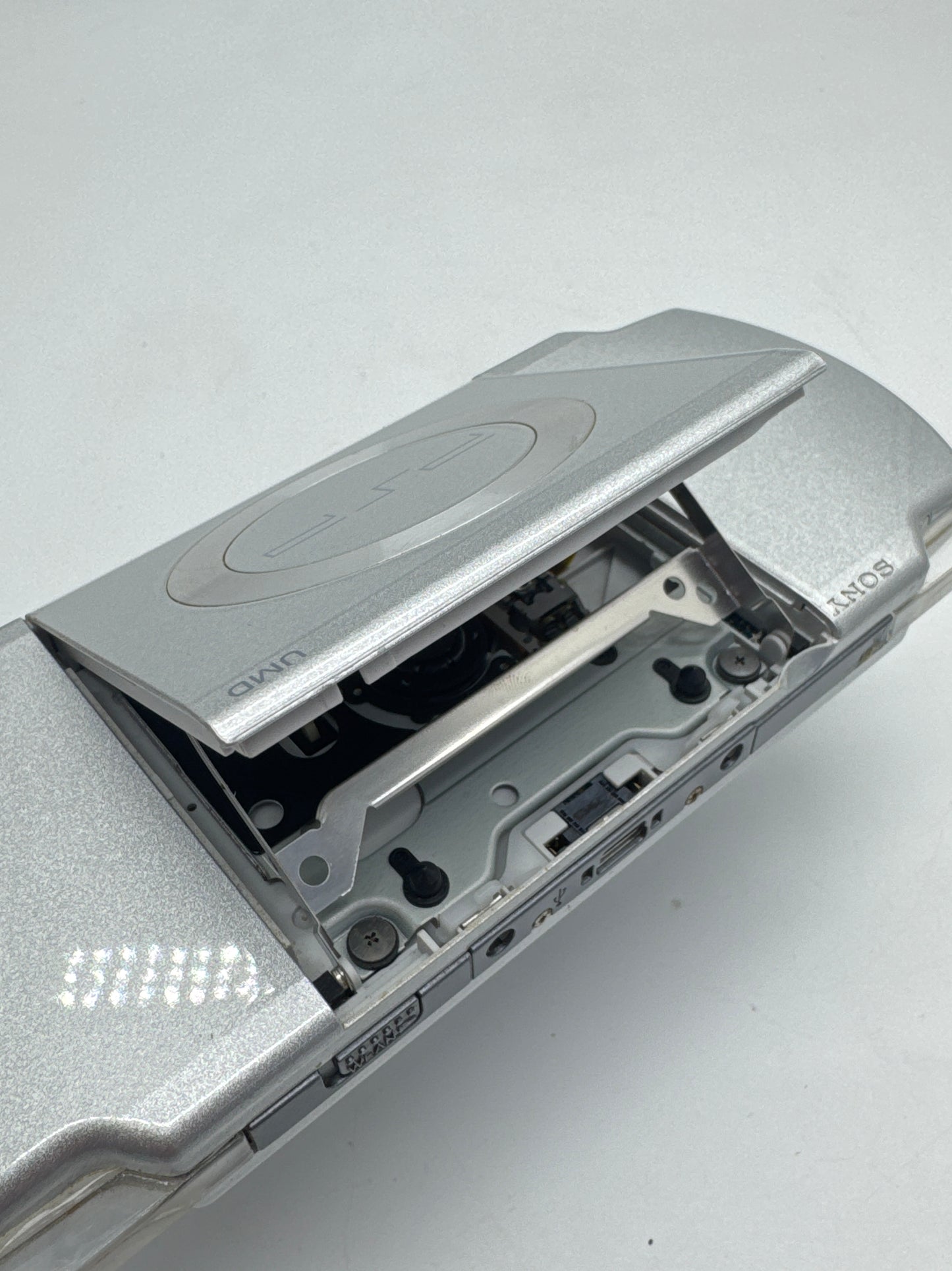 Sony PSP-2000 Silver Console #297 w/1200mAh Battery No Charger BAD UMD DRIVE AS IS