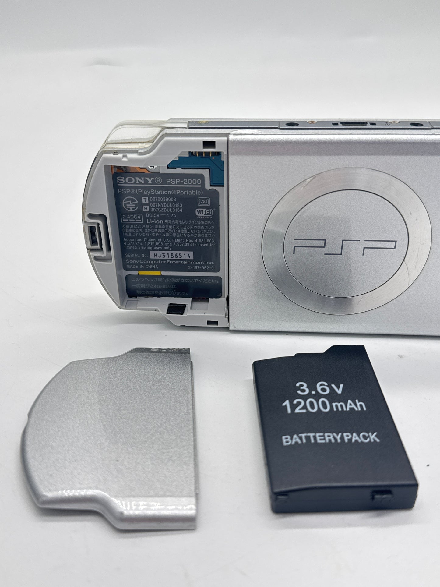Sony PSP-2000 Silver Console #297 w/1200mAh Battery No Charger BAD UMD DRIVE AS IS